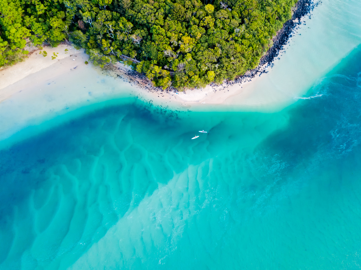 An aerial global view of the beach with blue water