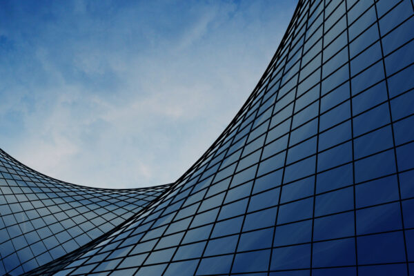 A view of the exterior walls of Bravura Solutions' building and the clouds in the sky