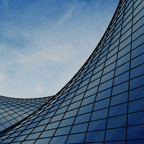 A view of the exterior walls of Bravura Solutions' building and the clouds in the sky