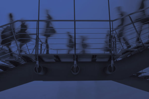 Motion image with purple effect of people walking at the stairs