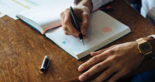 An image of a client at the desk scheduling the financial platform implementation