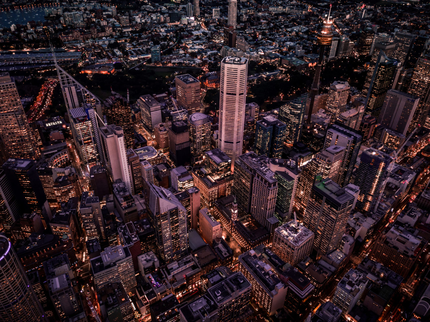 A view of tall buildings in the downtown of an international city.