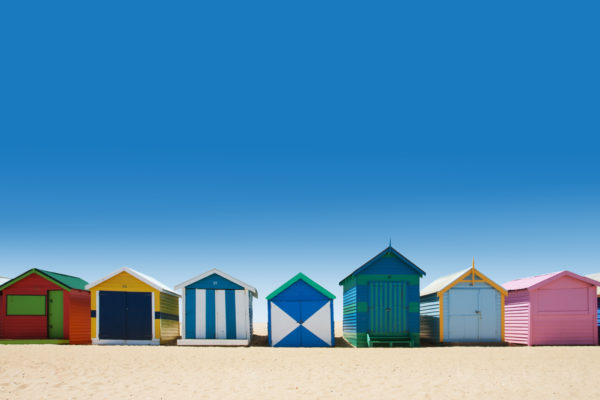 Beautiful bathing houses on white sand beach in Australia