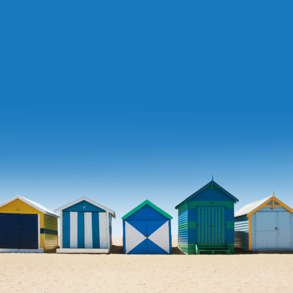 Beautiful bathing houses on white sand beach in Australia
