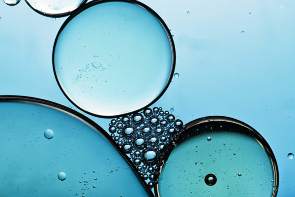 An abstract image displaying the integration between oil and water through bubbles