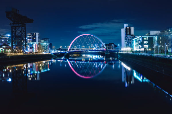 A panoramic of a night at the Clyde Arc bridge in Glasgow Scotland