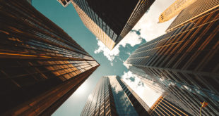 Low angle view of the skyscrapers in New York with a cloud as background