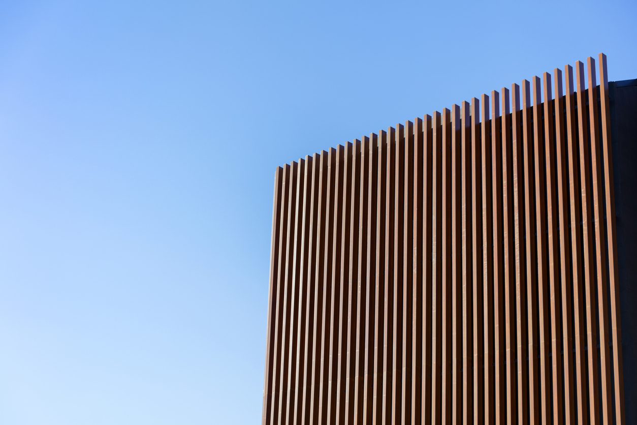 Wooden construction of a digital company with a blue sky in the background