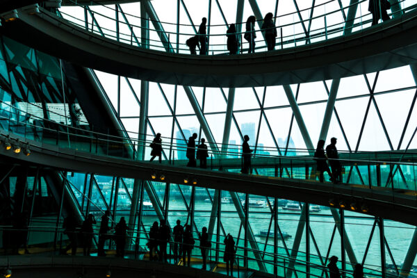 People walking in the innovative interior architecture of a business building in the UK