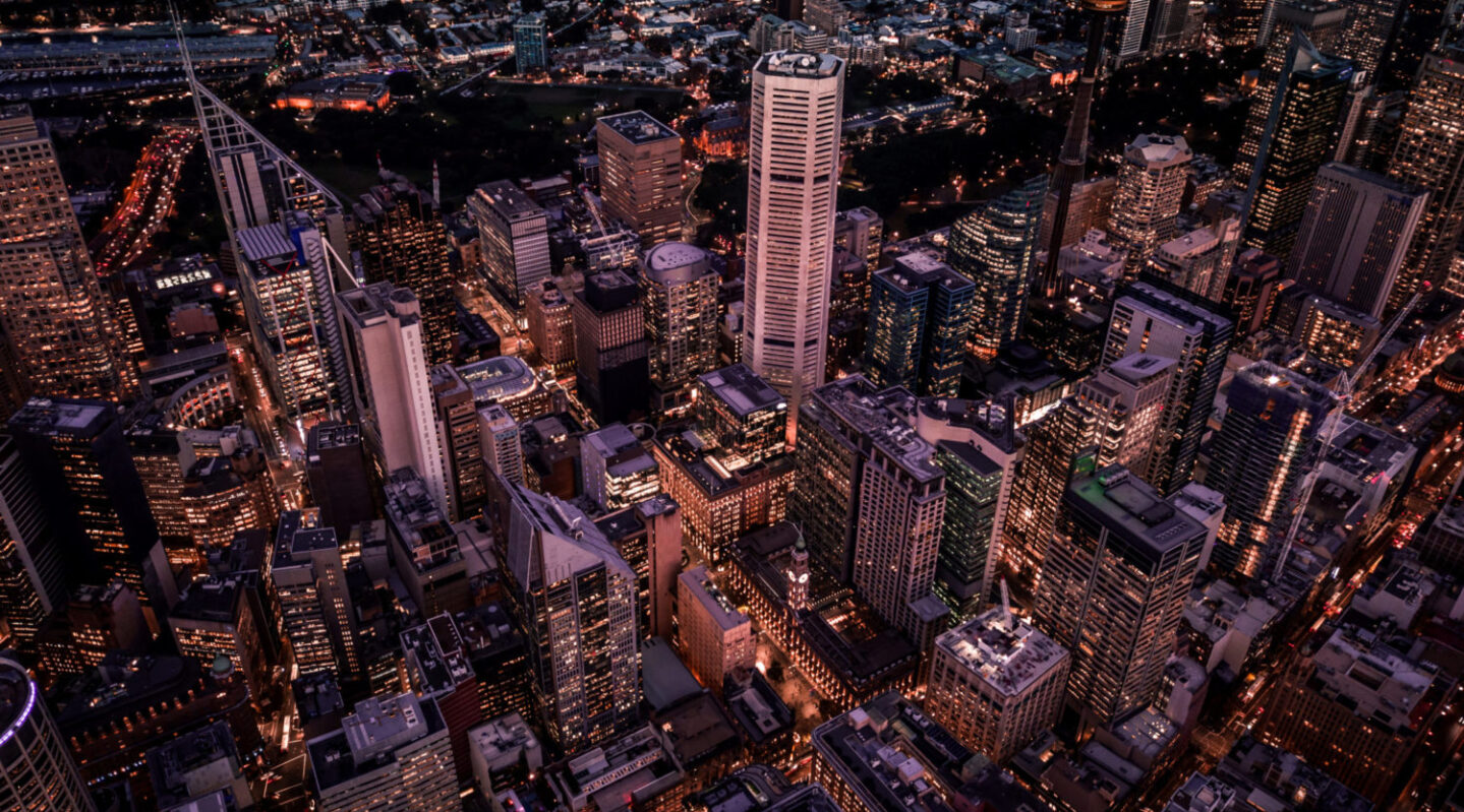 A view of tall buildings in the downtown of an international city.